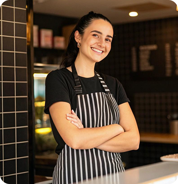 Smiling front-of-house restaurant worker with apron – hourly food service job connected by Ponte